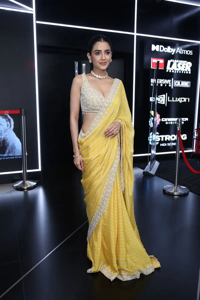 TELUGU ACTRESS MALVIKA SHARMA IN YELLOW SAREE SLEEVELESS BLOUSE 1